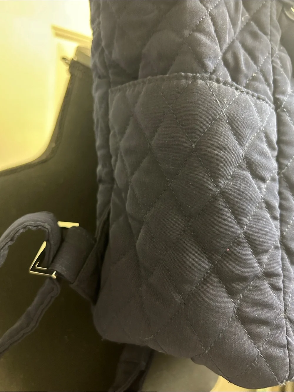 Vera Bradley quilted backpack in navy blue, diamond pattern a front flap closure